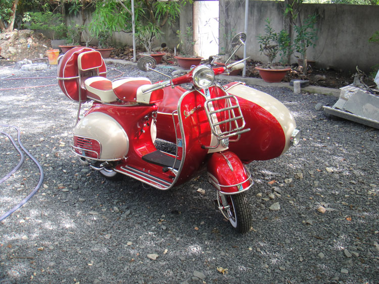 Red and white Vespa VBB sidecar final condition before international export and shipping